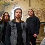 Living Wreckage drop video for “One Foot In The Grave”